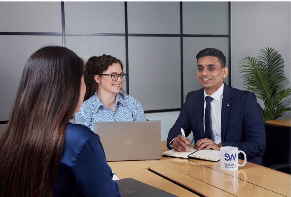 Business meeting with team members discussing solutions